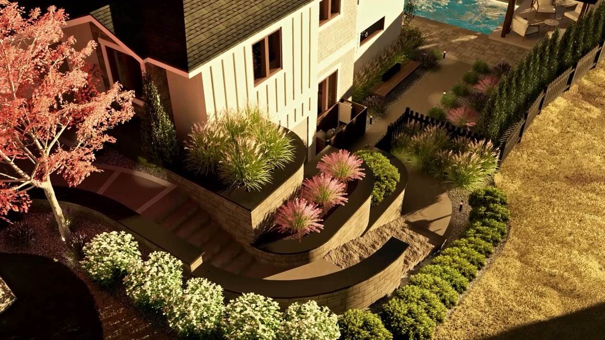 Terraced retaining walls with curved planting beds and steps, seen from above in evening light