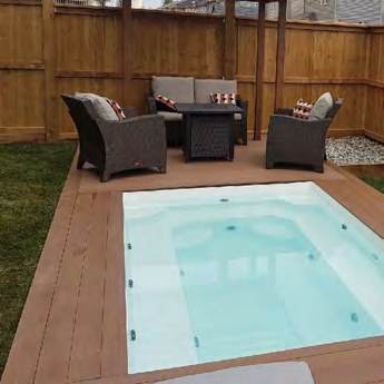 Swim spa set into a timber and paver deck